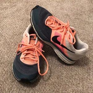 Coral and gray Nike tennis shoes